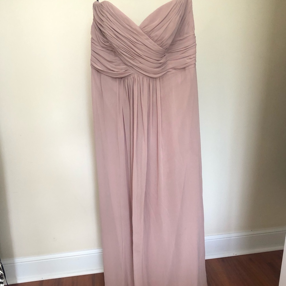 Beige strapless bridesmaid dress.